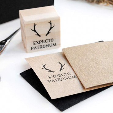 Creative scrapbook page featuring the Expecto Patronum stamp, blending geeky themes with enchanting design elements.
