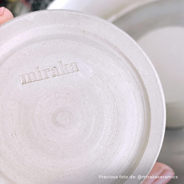 A tool for marking ceramics with a custom logo, ideal for personalizing clay art. A tool for marking ceramics with a custom logo, ideal for personalizing clay art.