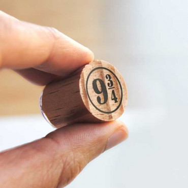 a wooden stamp designed like Platform 9¾, perfect for creating custom invitations and tickets
