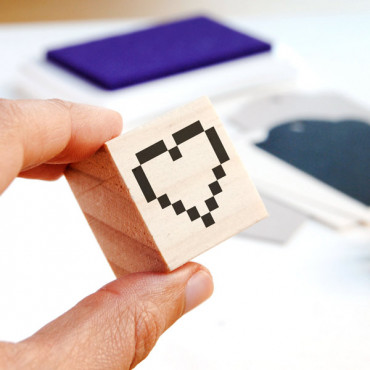The 8-bit Pixel Heart Stamp is perfect for gamers and retro enthusiasts