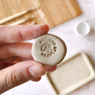 Premade ceramic logo stamp with custom name and three pottery vases