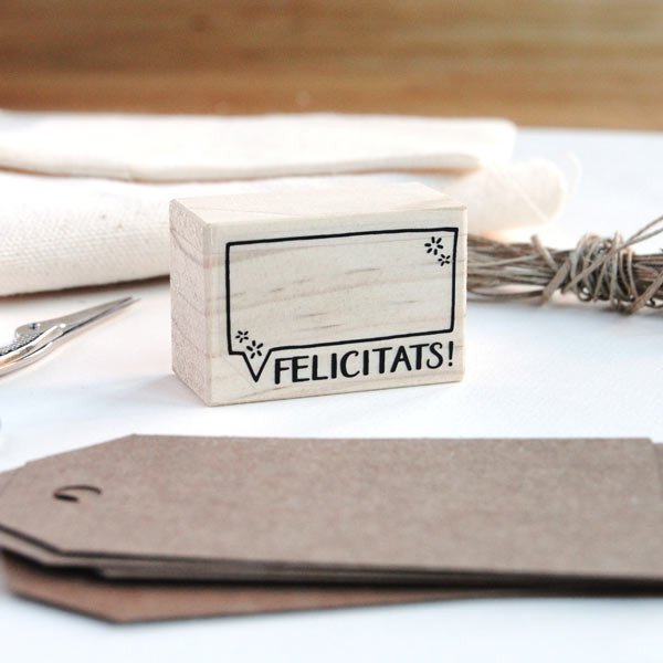 Rubber stamp "Felicitats" (Catalan) for teachers