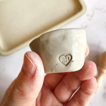 Custom stamp with heart and initials inside for ceramic signature