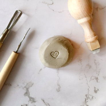 Custom stamp with heart and initials inside for pottery signature in your ceramic classes