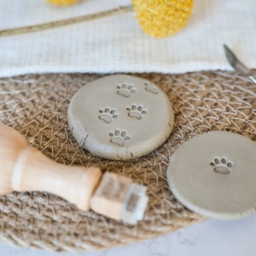 dog pawprint clay stamp by biterswit