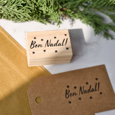 rubber stamp Merry Christmas with stars in multiple languages to choose