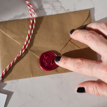 Beautiful Melchior wax seal used on a postcard, perfect for sending special messages with a royal flair
