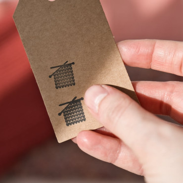 DIY handknitted hang tags with stamp symbols by biterswit