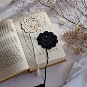 Artisan crochet book separator with a delicate floral design in neutral colors for an elegant touch.