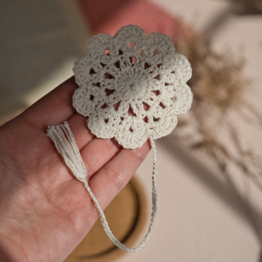 Handmade crochet book marker with a floral touch in beige or black, adding charm to any book.