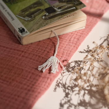 Handmade crochet book separator with a delicate floral design, perfect for any reader.
