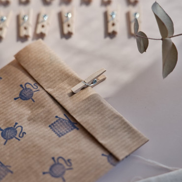 Versatile mini clothespins, perfect for small projects and dollhouse decor.