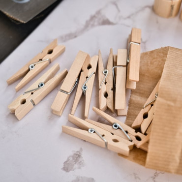 Small natural wood clips for creative craft projects and event decor.