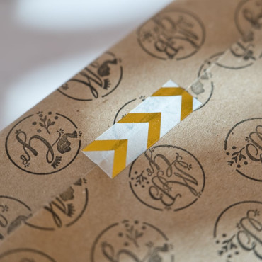 Decorative golden arrow washi tape for various DIY and craft uses.