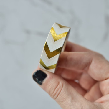 Golden arrow washi tape for gift wrapping, scrapbooking, and crafts.