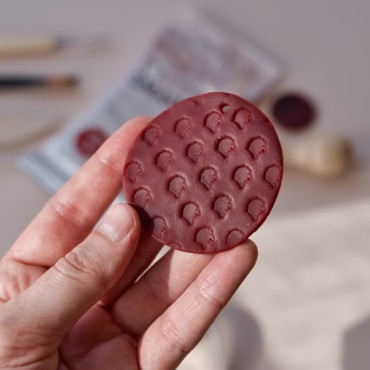 The red clay is a special modeling paste that air-dries into a sturdy yet slightly flexible material that won’t break.