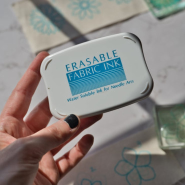 Stamp your design on fabric using special water-erasable ink.