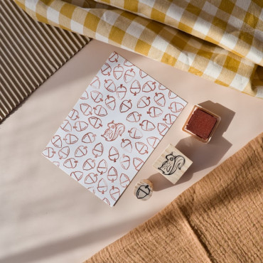 handprintted postcard with rubber stamps squirrel and acorn by sira lobo for biterswit