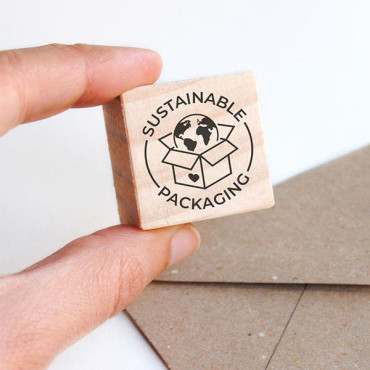 small wooden stamp sustainable packaging for custom eco envelopes by biterswit