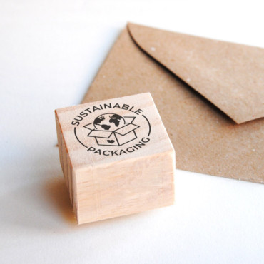 small wooden stamp sustainable packaging for custom eco envelopes by biterswit