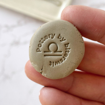 Zodiac pottery stamp with custom text for unique, personalized creations.