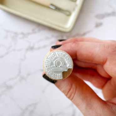 Personalized pottery stamp featuring your zodiac symbol and name for crafts.