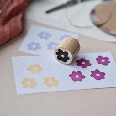 Mini Poppy stamp prints in Burgundy, Pale Yellow, and Pale Purple ink on white tags, adding vibrant colors.
