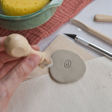Custom ceramic signature stamp with 1 or 2 initials inside an elegant oval shape