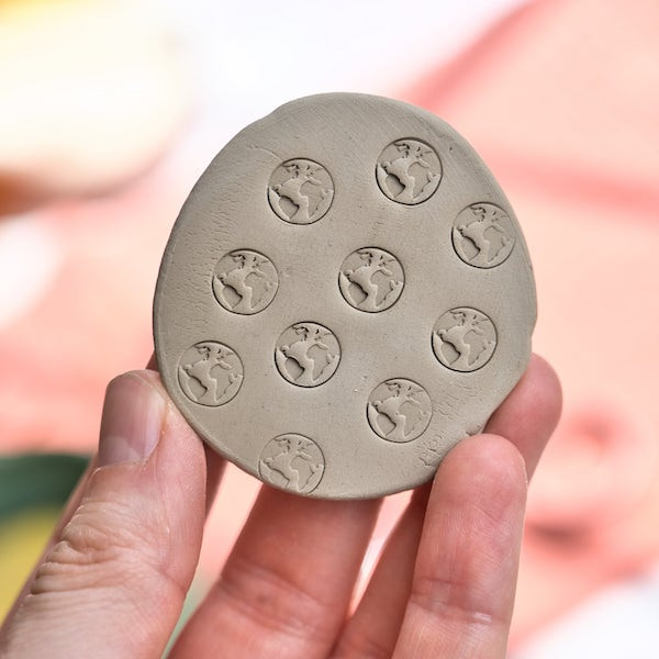 Mini world globe stamp for pottery, polymer clay, and soap decoration, perfect for artists and DIY crafting