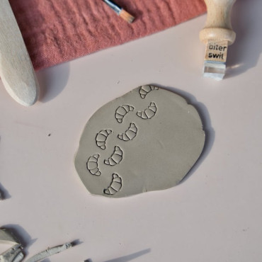 Ceramic texture stamp with mini croissant for brunch plate decoration and pastry-inspired pottery