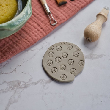 Peace sign pottery tool for stamping clay, ideal for meditation charms and boho ceramic art
